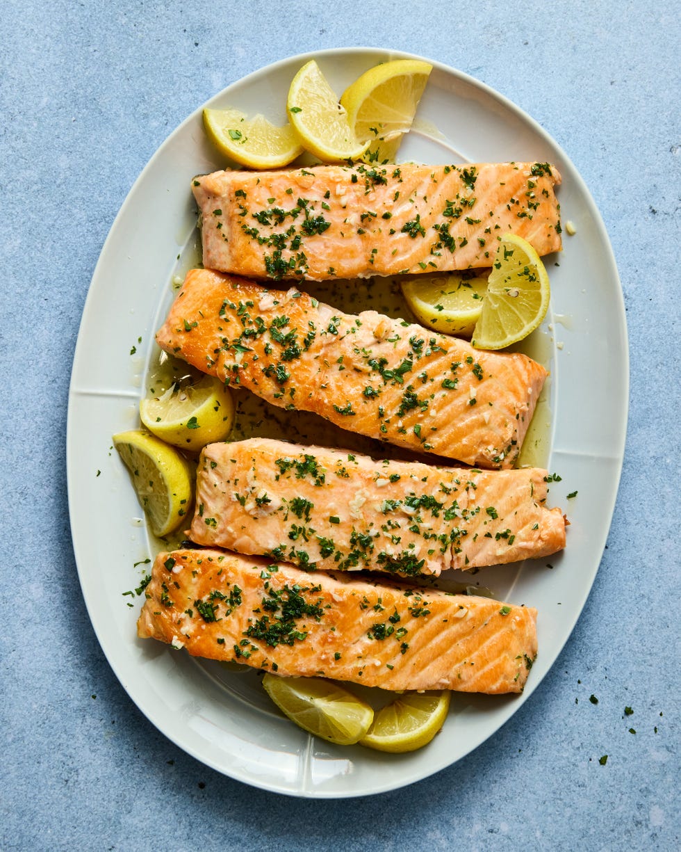 hearty salmon filets are generously seasoned with salt and pan seared in browned butter lemon zest and lemon juice, then topped with a flurry of freshly chopped herbs