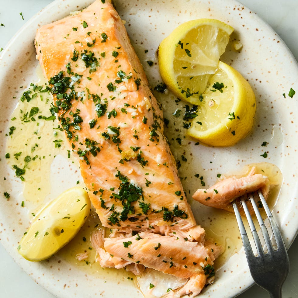 hearty salmon filets are generously seasoned with salt and pan seared in browned butter lemon zest and lemon juice, then topped with a flurry of freshly chopped herbs