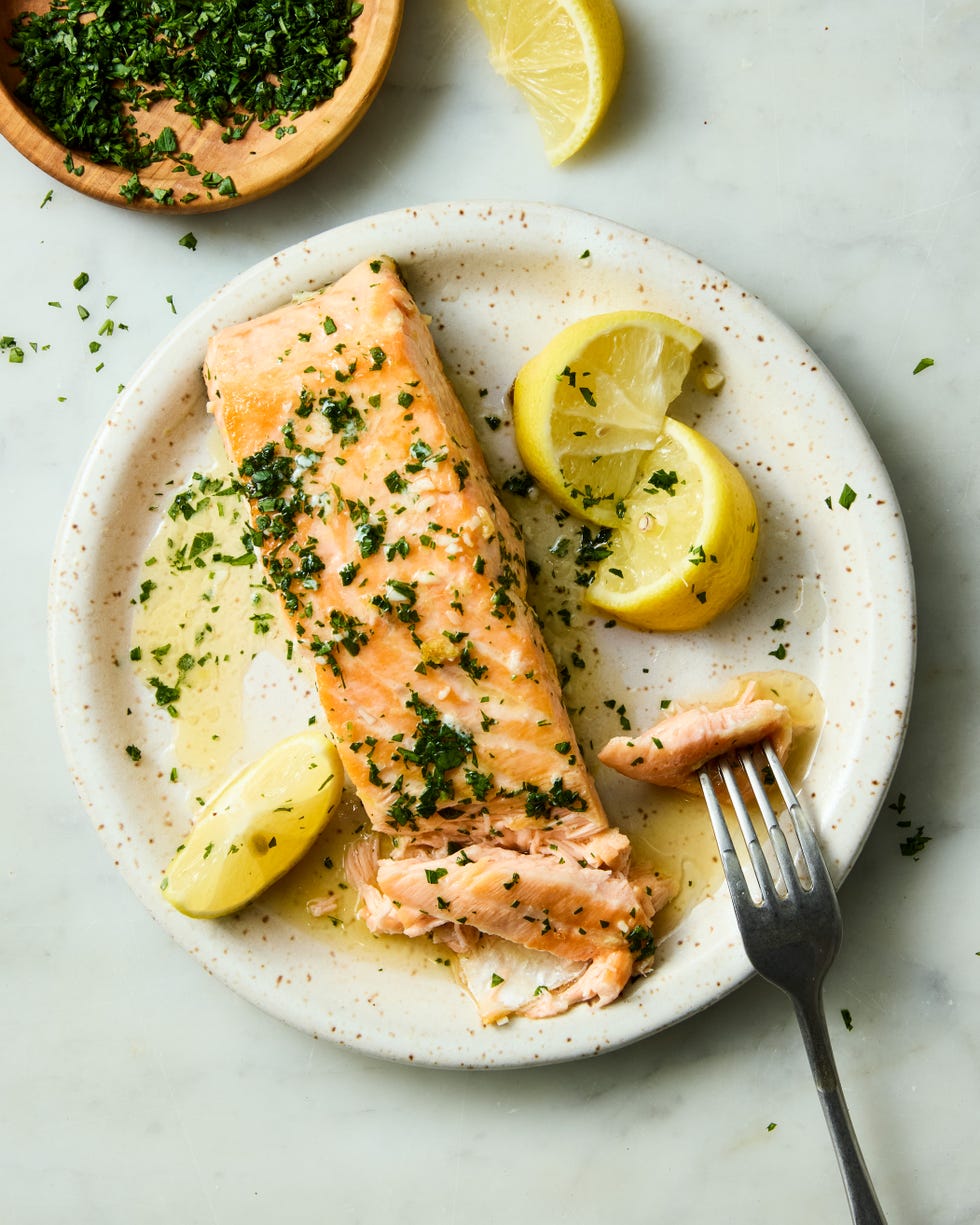 hearty salmon filets are generously seasoned with salt and pan seared in browned butter lemon zest and lemon juice, then topped with a flurry of freshly chopped herbs