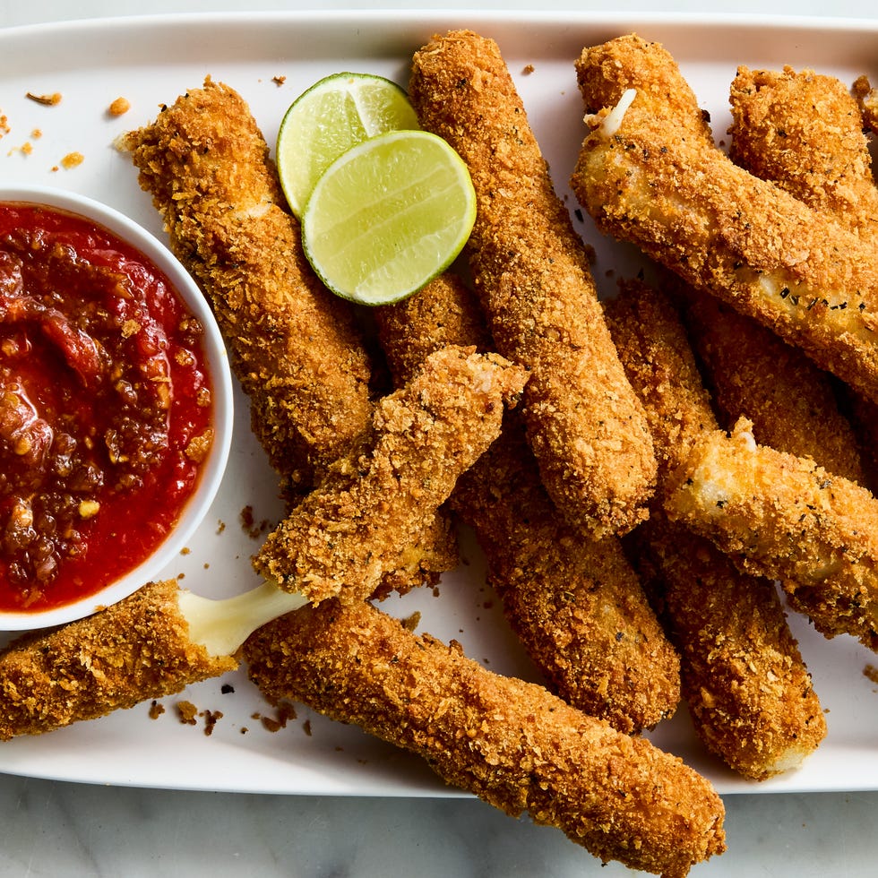 mozzarella sticks wrapped rice paper, then bread with parm and basil studded panko and fried until deep golden brown, ooey, gooey, and a little bit chewy