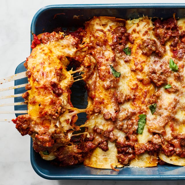 saucy beef bolognese, and herby ricotta rolled into flour tortillas and topped with more bolognese mozzarella and parmesan then baked until bubbly and perfect