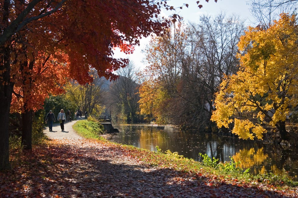 couple walking along canal path in lambertville, new jersey