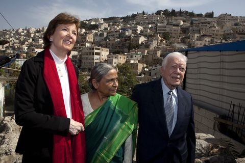 former president jimmy carter walking with two women during visit with mideast israel palestinian elders in israel