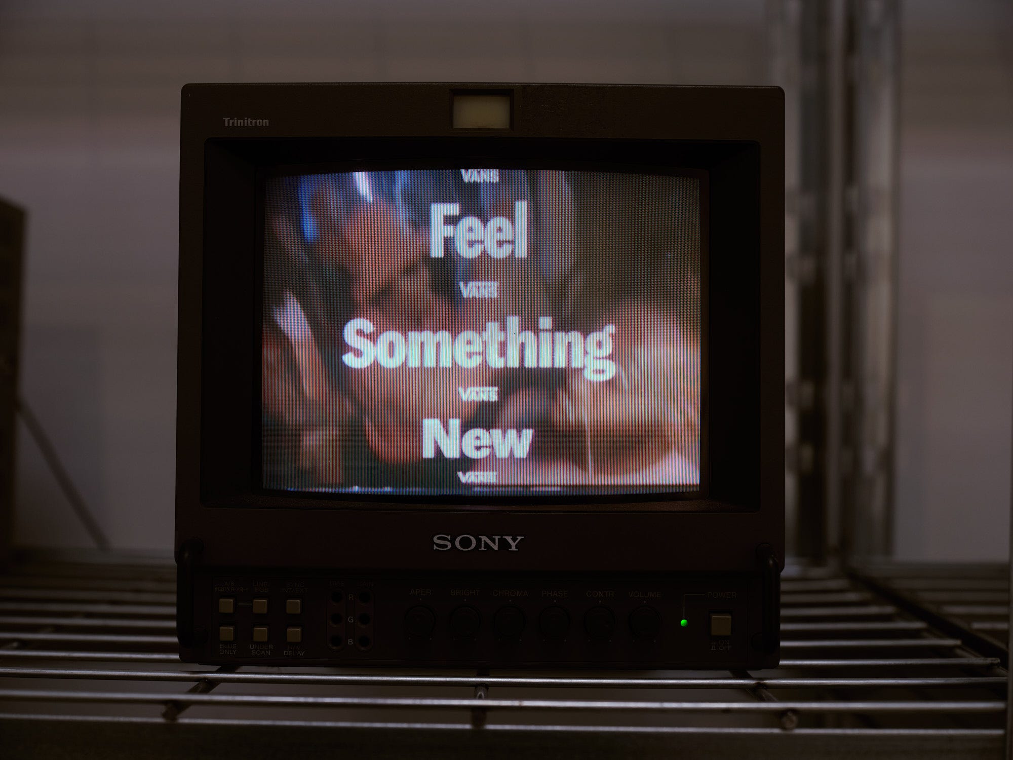 vintage television displaying promotional text for vans