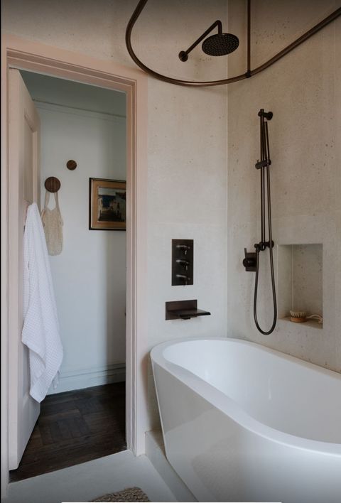pale pink bathroom with tiny tub