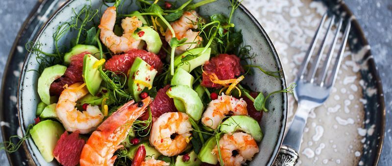 https://hips.hearstapps.com/hmg-prod/images/delicious-fresh-salad-with-prawns-grapefruit-royalty-free-image-1643039066.jpg?crop=1xw:0.84415xh;center,top&resize=1200:*