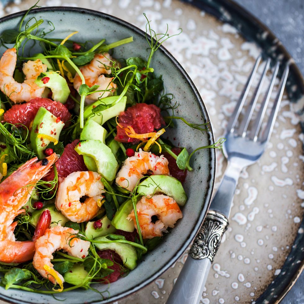 delicious fresh salad with prawns, grapefruit, avocado, cucumber and herbs