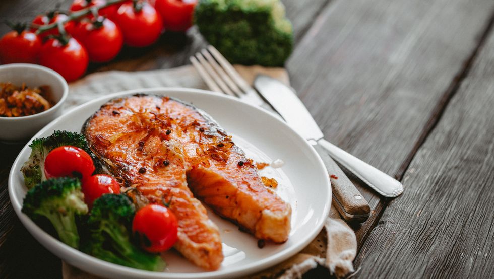 delicious grilled salmon with vegetables on plate healthy food