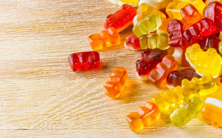 Delicious gummies on a wooden table