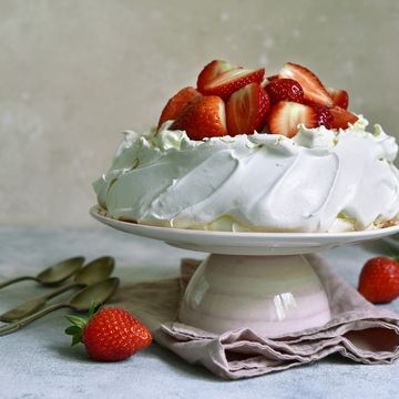 delicious summer cake "pavlova" with whipped cream and fresh strawberry