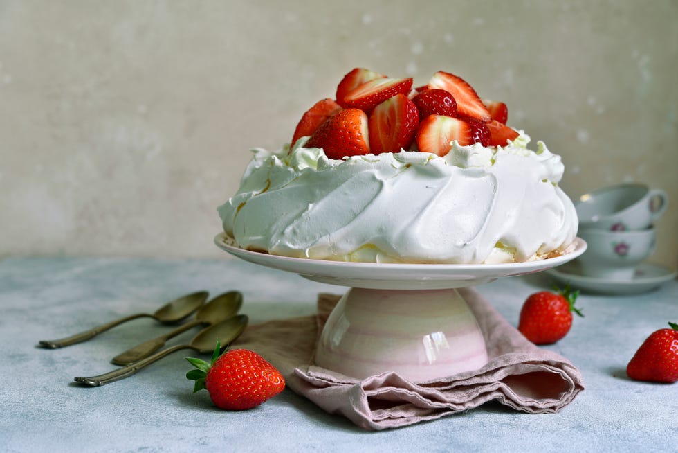 delicious summer cake "pavlova" with whipped cream and fresh strawberry