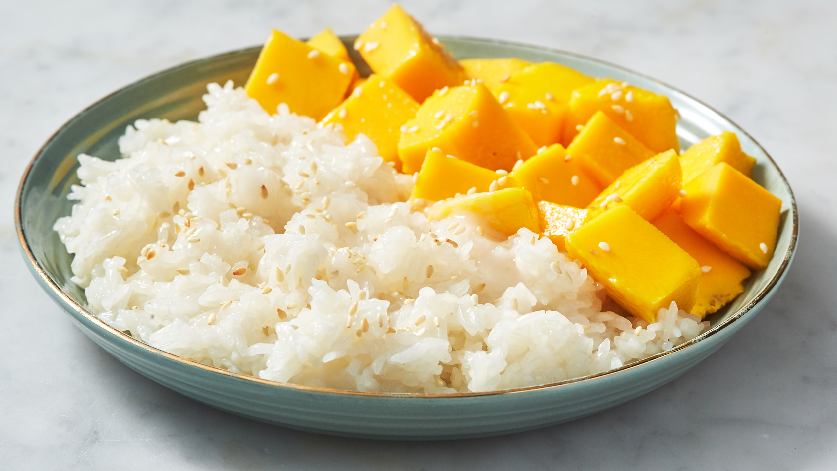https://hips.hearstapps.com/hmg-prod/images/delish-190618-mango-sticky-rice-255-landscape-pf-1561646936.png?crop=0.888888888888889xw:1xh;center,top