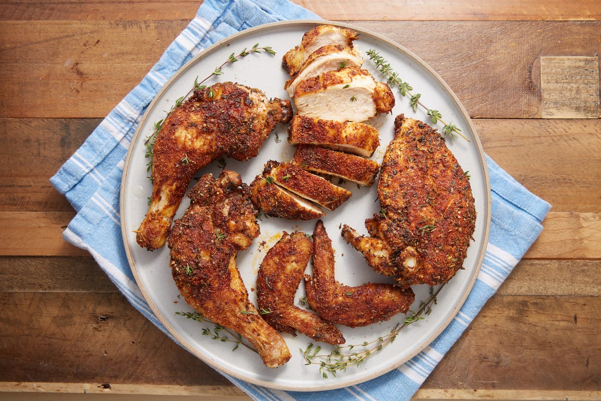 https://hips.hearstapps.com/hmg-prod/images/delish-190620-air-fryer-rotisserie-chicken-0479-landscape-pf-1564070981.jpg?crop=0.8891228070175439xw:1xh;center,top&resize=1200:*