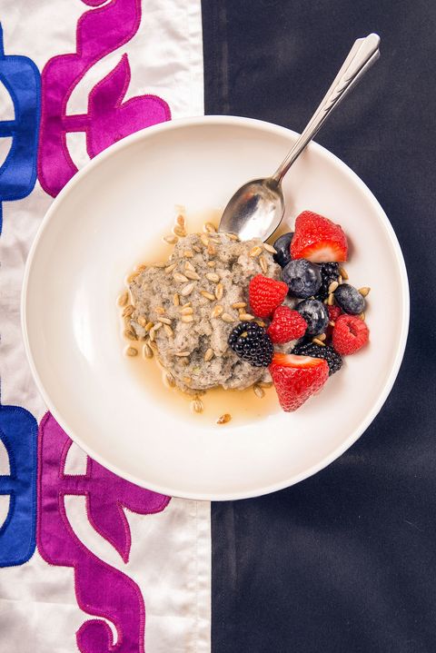 wild rice pudding with sunflower seeds, maple syrup, and mixed berries