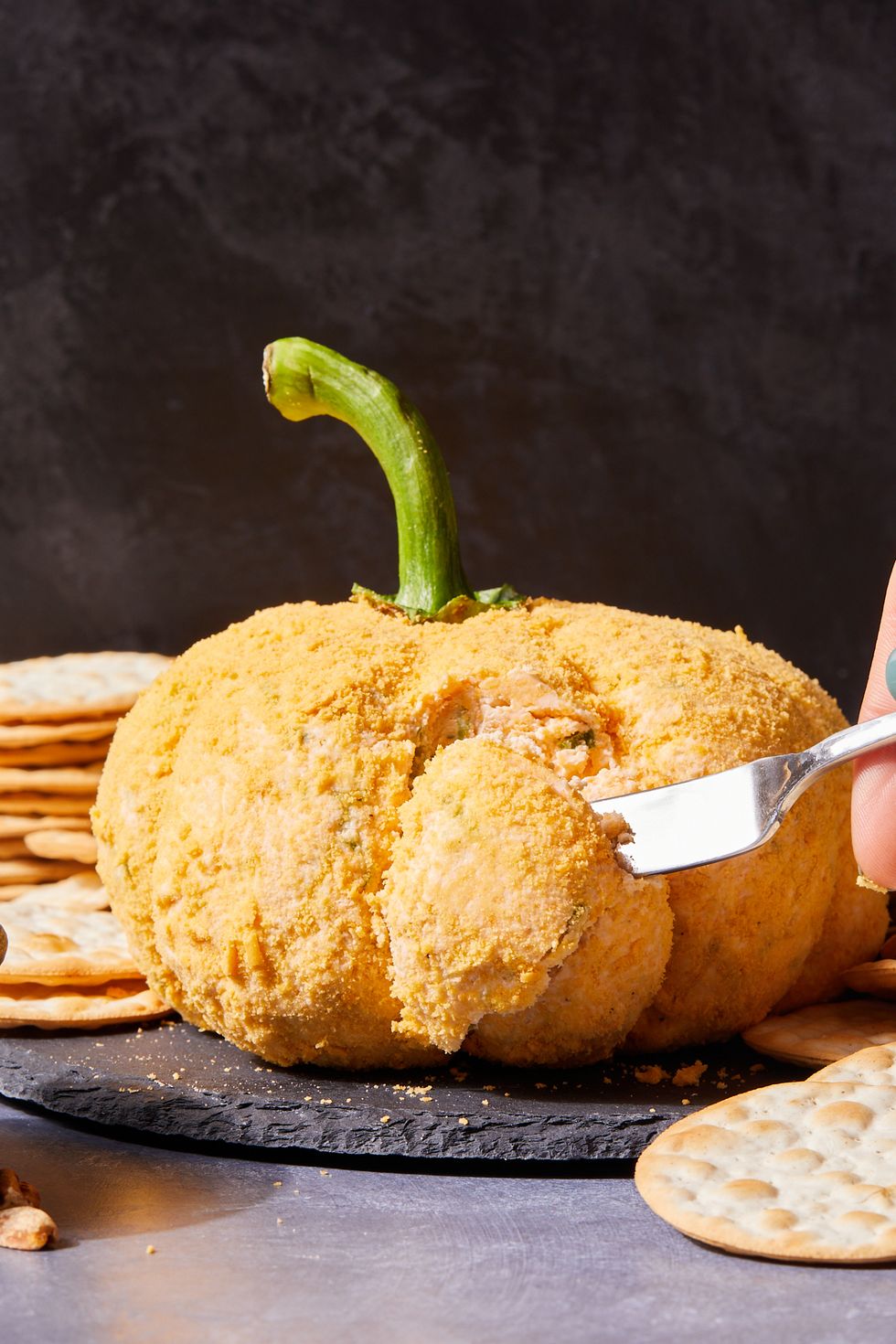pumpkin cheese ball with crackers