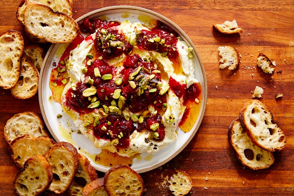 whipped garlic and herb feta, topped with fresh cranberry sauce, pistachios, and honey