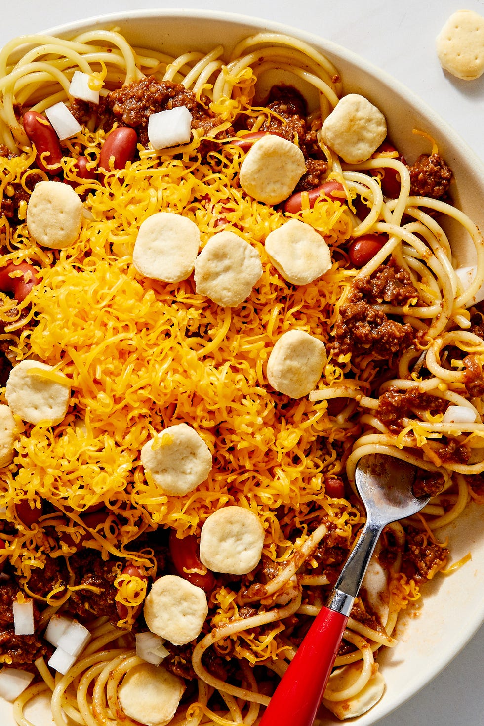 Cincinnati Chili cincinnati chili with cheddar, kidney beans, onion, and oyster crackers