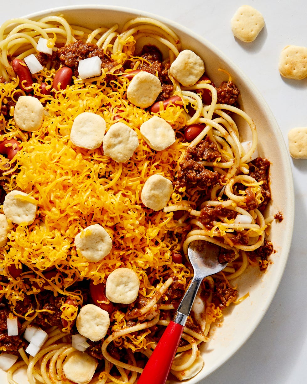 cincinnati chili with cheddar, kidney beans, onion, and oyster crackers