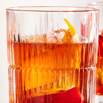 Old Fashioned Cocktail bourbon old fashioned with demerara sugar, bitters, maraschino cherry, and orange peel
