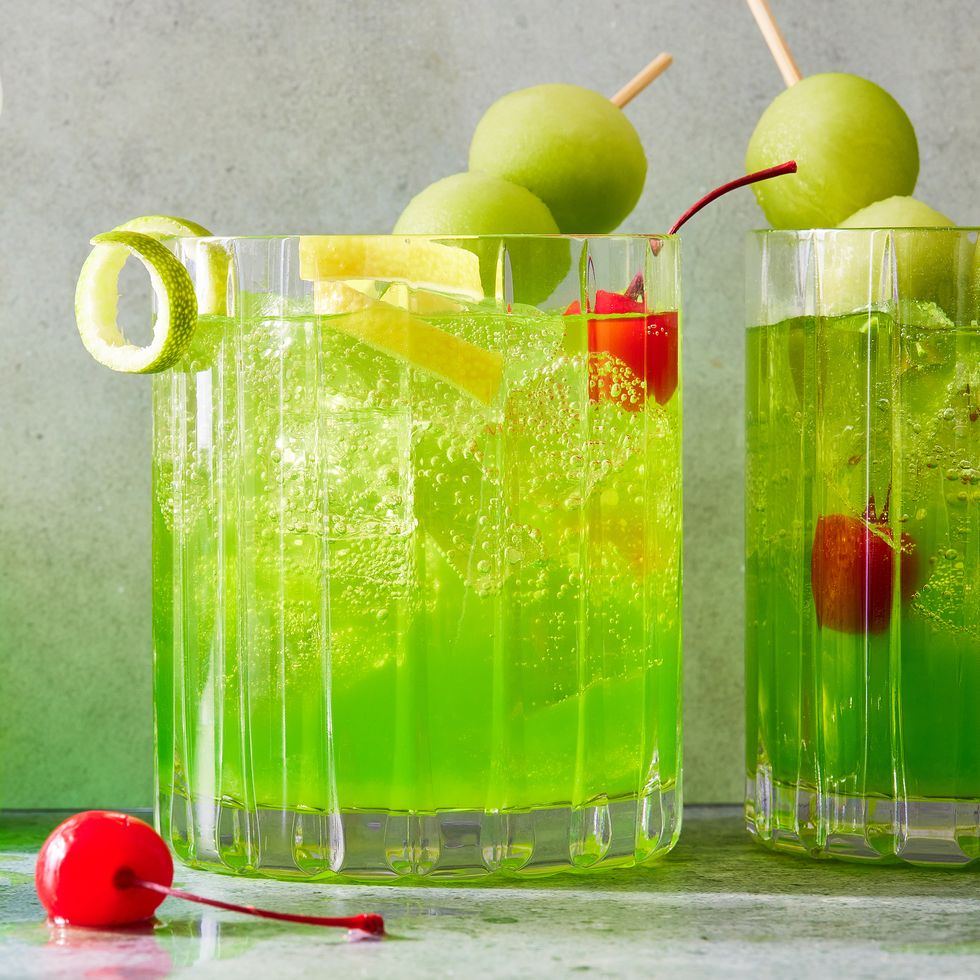 midori sour with melon balls and cherries