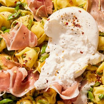 butter toasted cheese tortellini with snap peas, spring peas, prosciutto, creamy burrata, lemon, and red pepper flakes