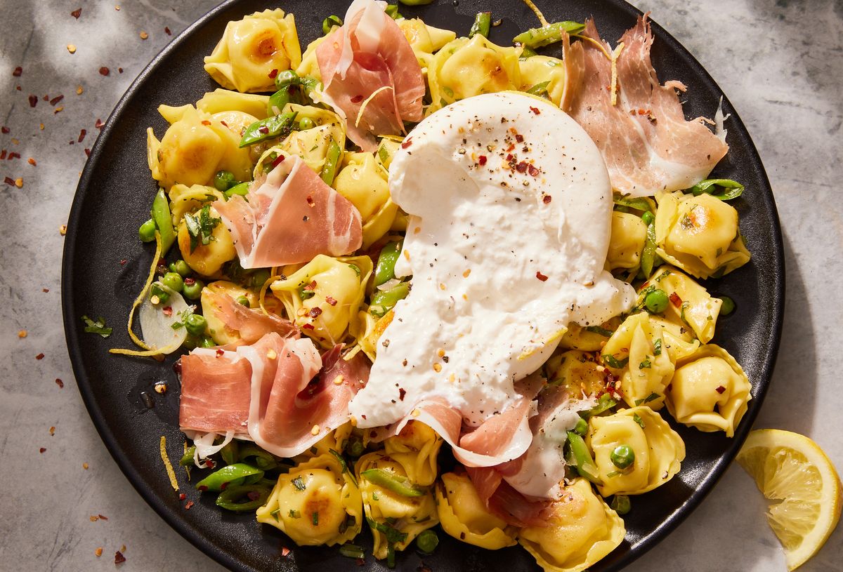 butter toasted tortellini, snap peas, sweet peas, creamy burrata, prosciutto, lemon zest, and red pepper flakes