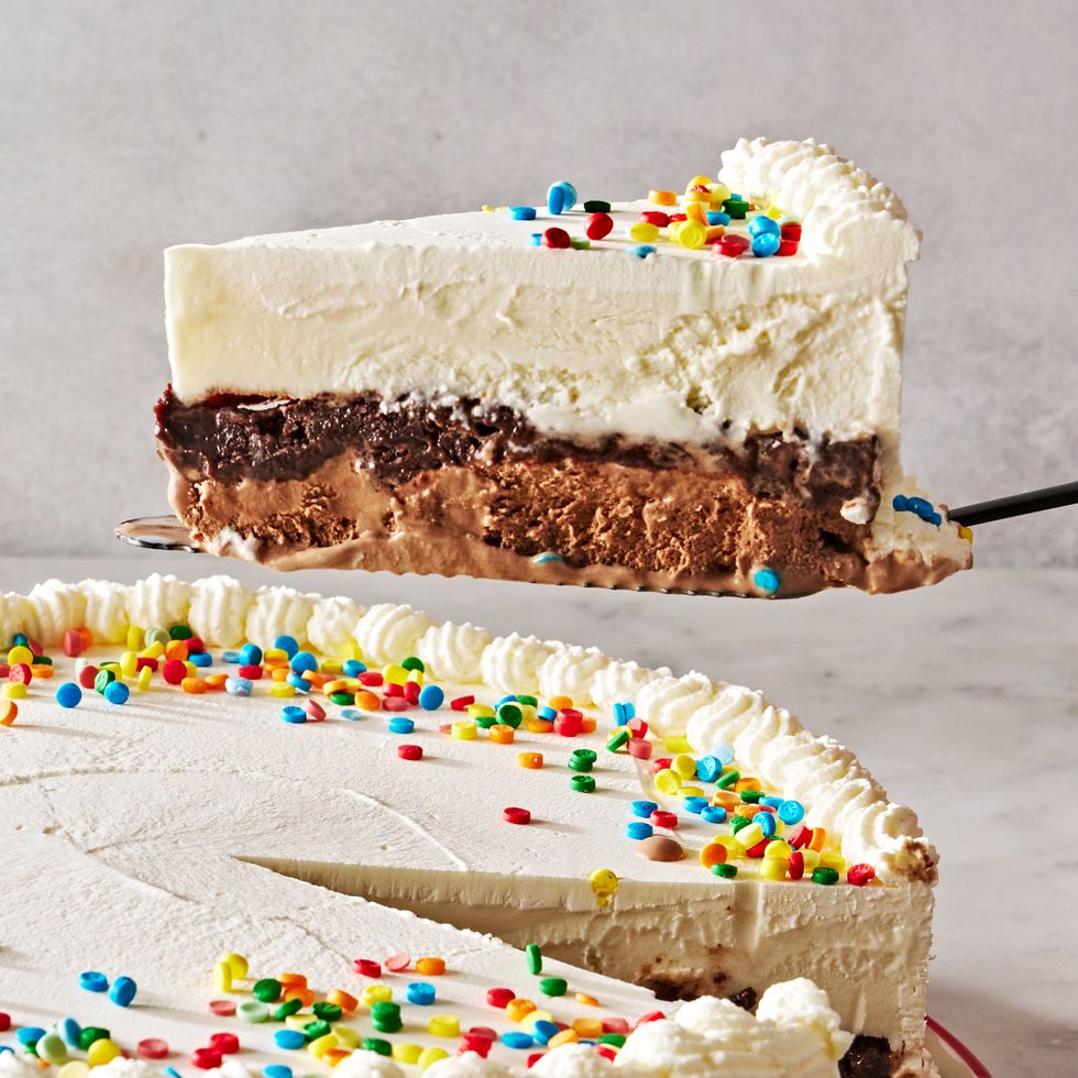 slice of copycat dairy queen ice cream cake lifted up from full cake