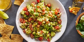 diced avocado tossed with tomato, fresh corn, red onion, jalapeno, cilantro, and lime juice, served with tortilla chips