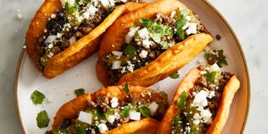 chalupas with ground beef beans onions cojita and salsa verde