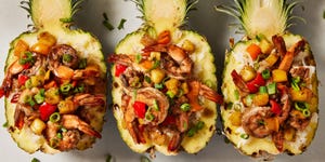 jerk marinated and grilled shrimp tossed with fresh pineapple and sweet bell pepper served over ice in a hollowed pineapple bowl