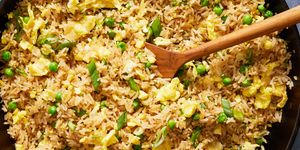 fried rice with eggs, scallions and peas