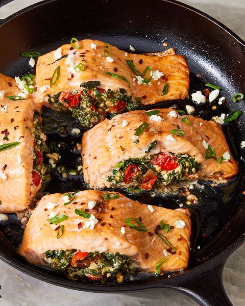 roasted salmon fillet stuffed with feta, spinach, and tomato and topped with crushed red pepper and scallions