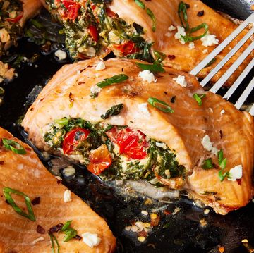 roasted salmon fillet stuffed with feta, spinach, and tomato and topped with crushed red pepper and scallions