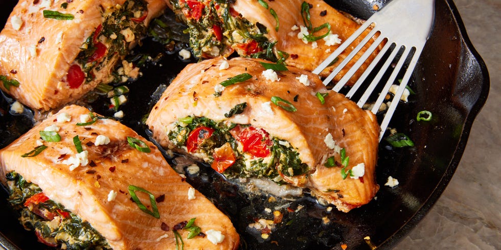 roasted salmon fillet stuffed with feta, spinach, and tomato and topped with crushed red pepper and scallions