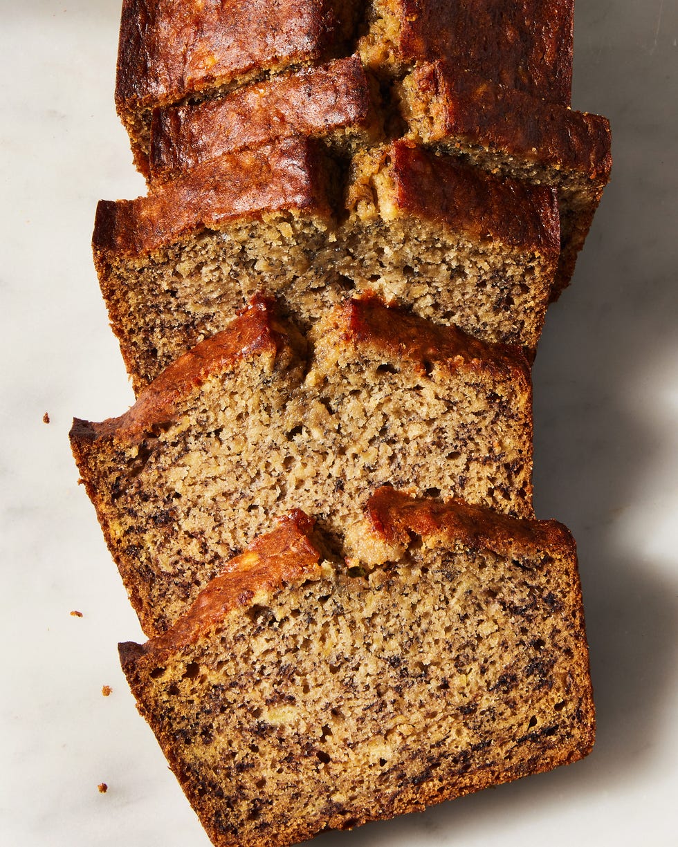 banana bread sliced on a white surface