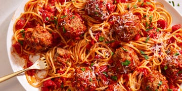 copycat olive garden meatballs with spaghetti on a platter