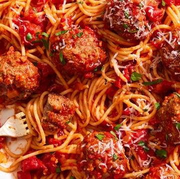 copycat olive garden meatballs with spaghetti on a platter