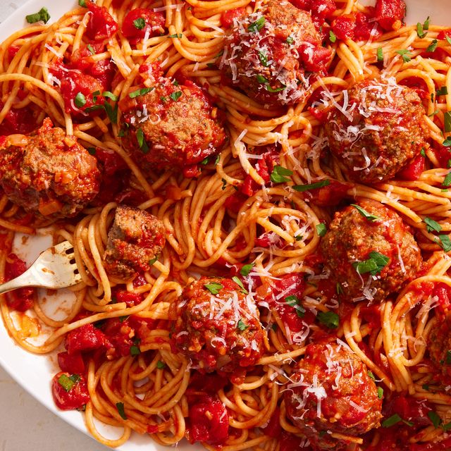 copycat olive garden meatballs with spaghetti on a platter
