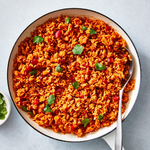 spanish rice garnished with cilantro leaves