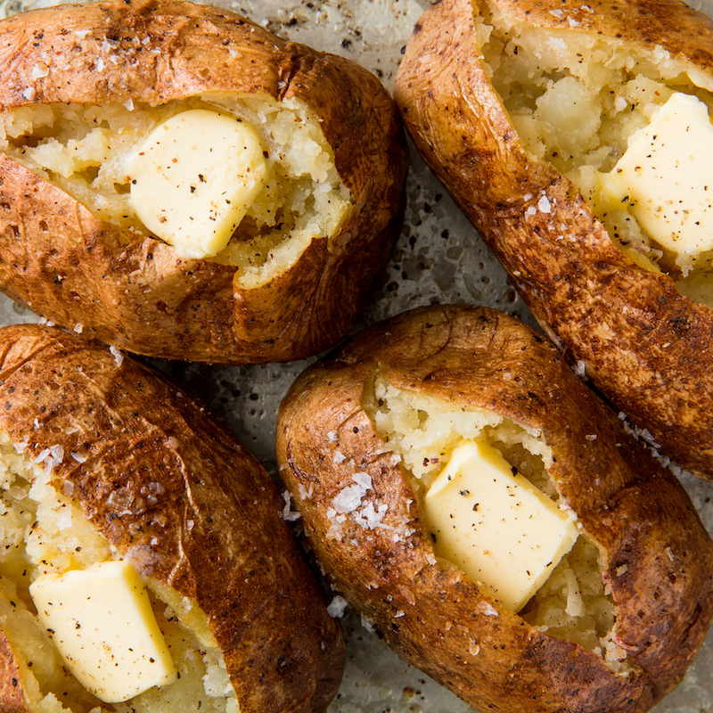 https://hips.hearstapps.com/hmg-prod/images/delish-baked-potatoes-horizontal-1532986298.png?crop=0.6666666666666666xw:1xh;center,top&resize=1200:*