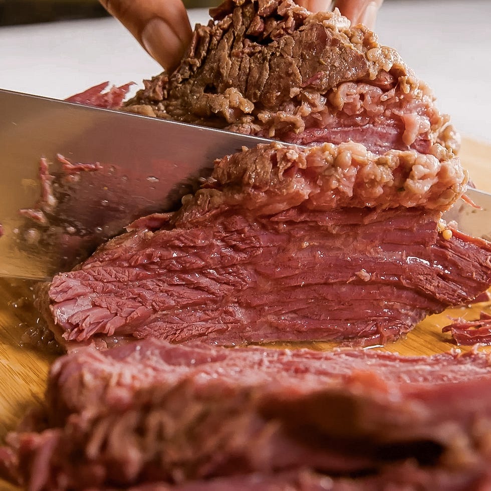 cutting corned beef on a cutting board