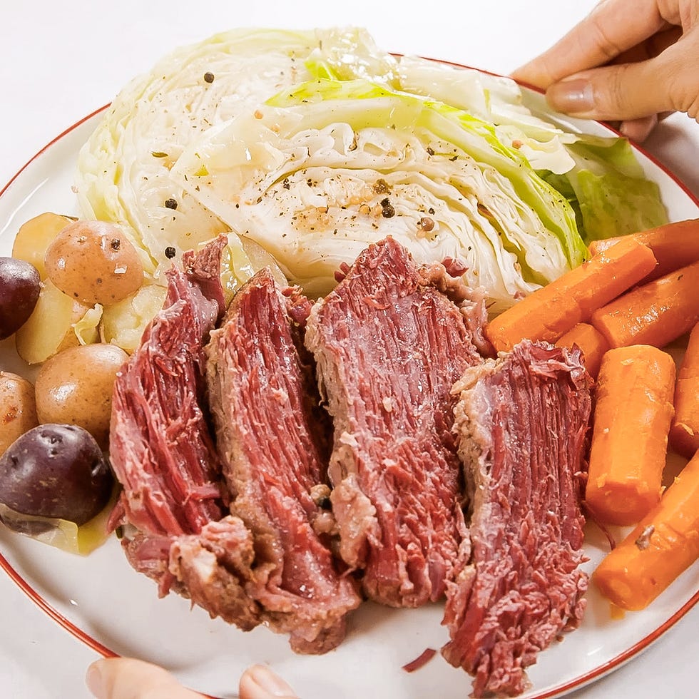 corned beef, carrots, potatoes, and cabbage on a platter