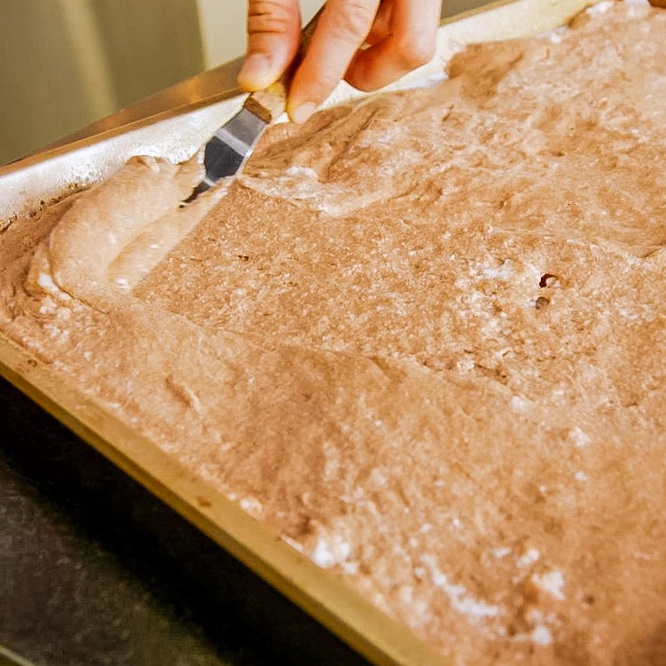 mixing batter in a baking pan