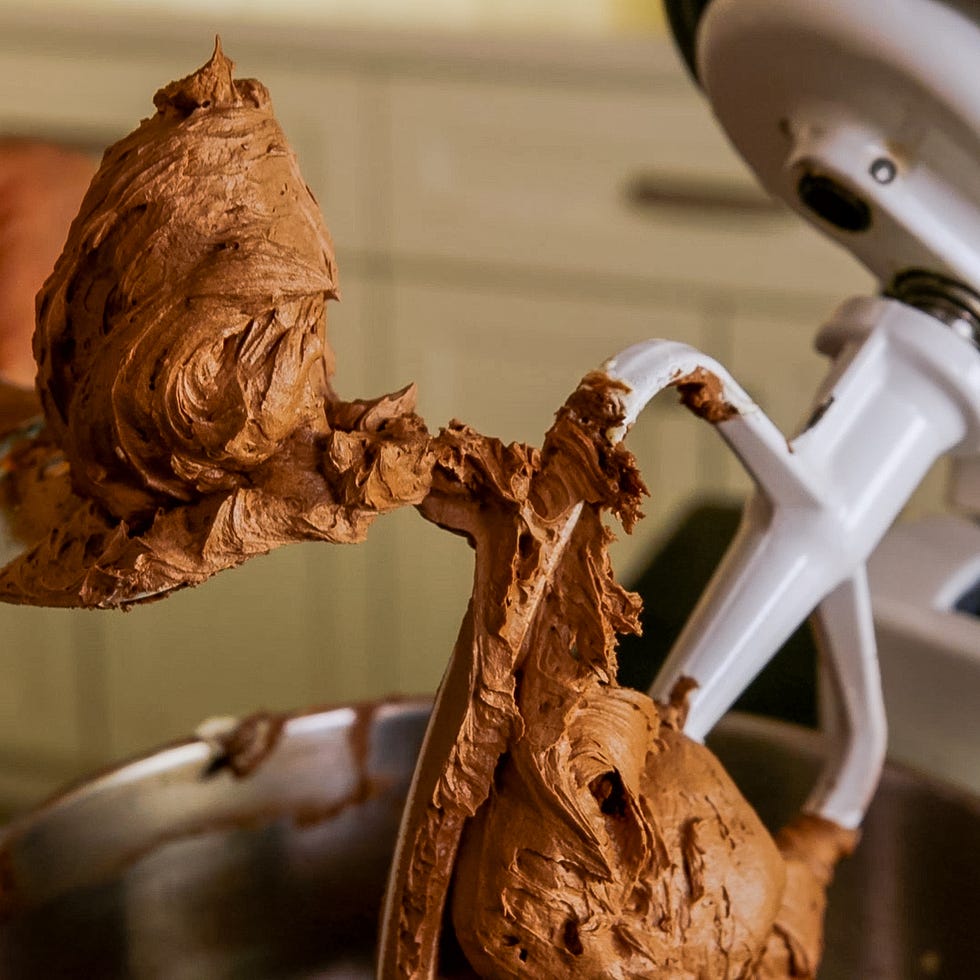 mixing chocolate frosting with a stand mixer attachment