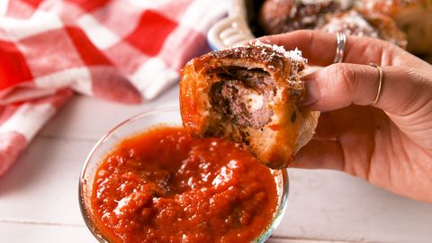 preview for These Tacky Meatball Bombs Are A Dream Come Correct  Tacky Meatballs Bombs delish cheesy spaghetti meatball bombs still004 1568734179