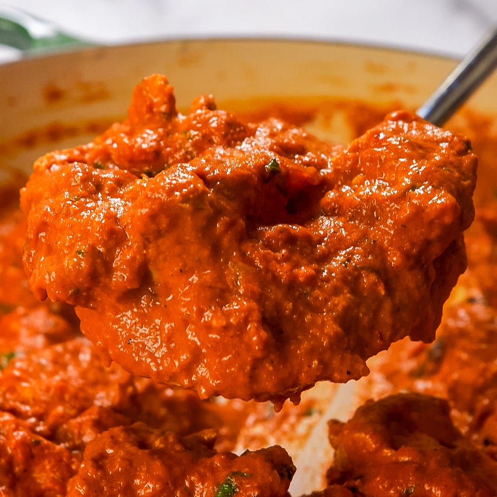 spoonful of thick rich tomatobased sauce with herbs