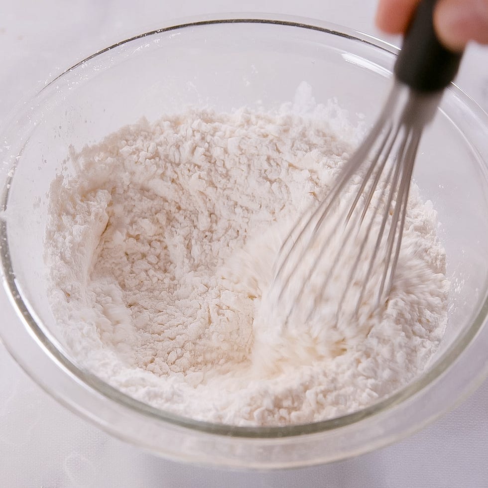 mixing dry ingredients in a glass bowl