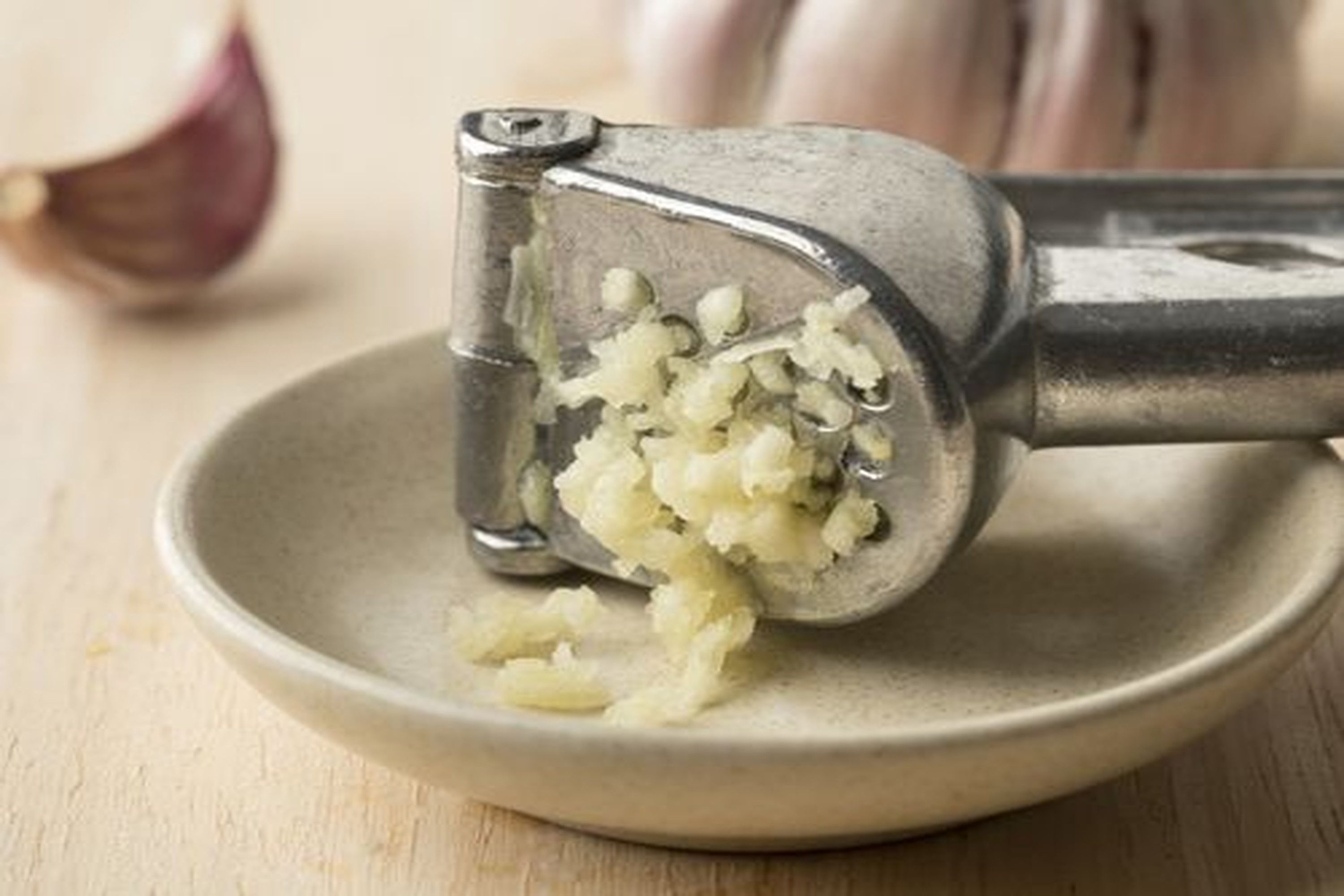 Why You Shouldn't Peel Your Garlic When You Use a Garlic Press