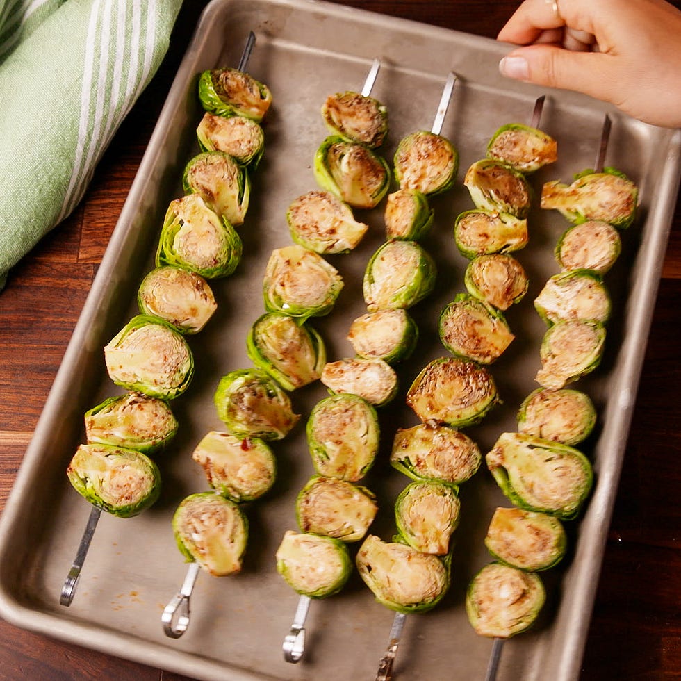 brussels sprouts skewers on a baking tray