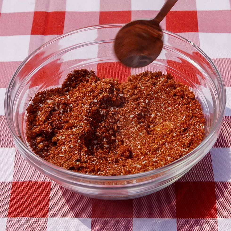 bowl containing brown sugar mix being stirred with a wooden spoon